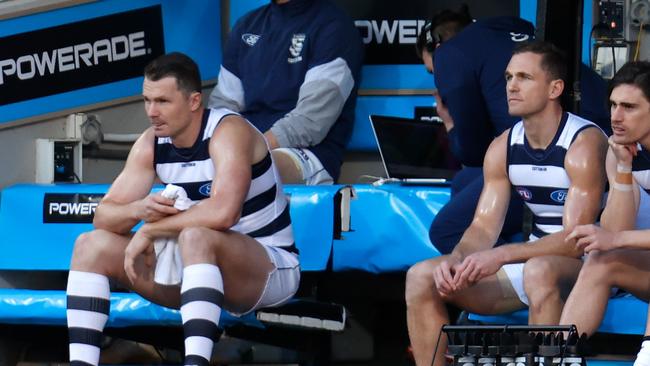 Patrick Dangerfield and Joel Selwood watch the first bounce of Saturday’s qualifying final. Picture: Michael Willson/AFL Photos via Getty Images