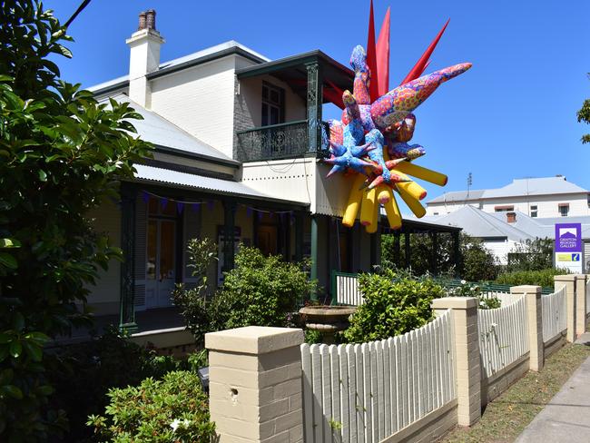 An abstract artwork promotes one of the many exhibitions currently on display at the Grafton Regional Gallery to coincide with the Jacaranda Festival.