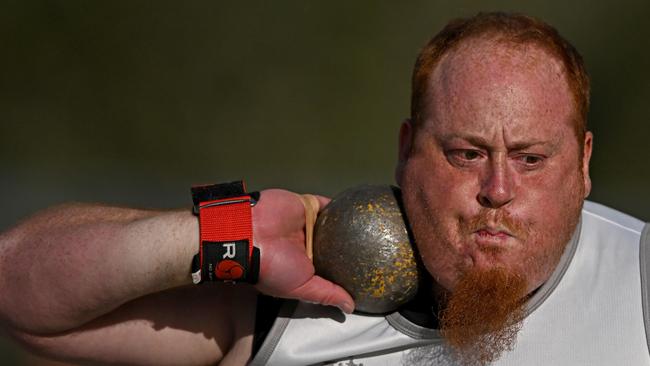 Shane Carstairs thinks through his shot put attempt. Picture: Andy Brownbill