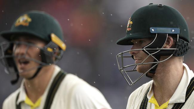 Steve Smith (right) and Marnus Labuschagne leave the ground during a rain delay at Old Trafford overnight. Picture: Getty Images