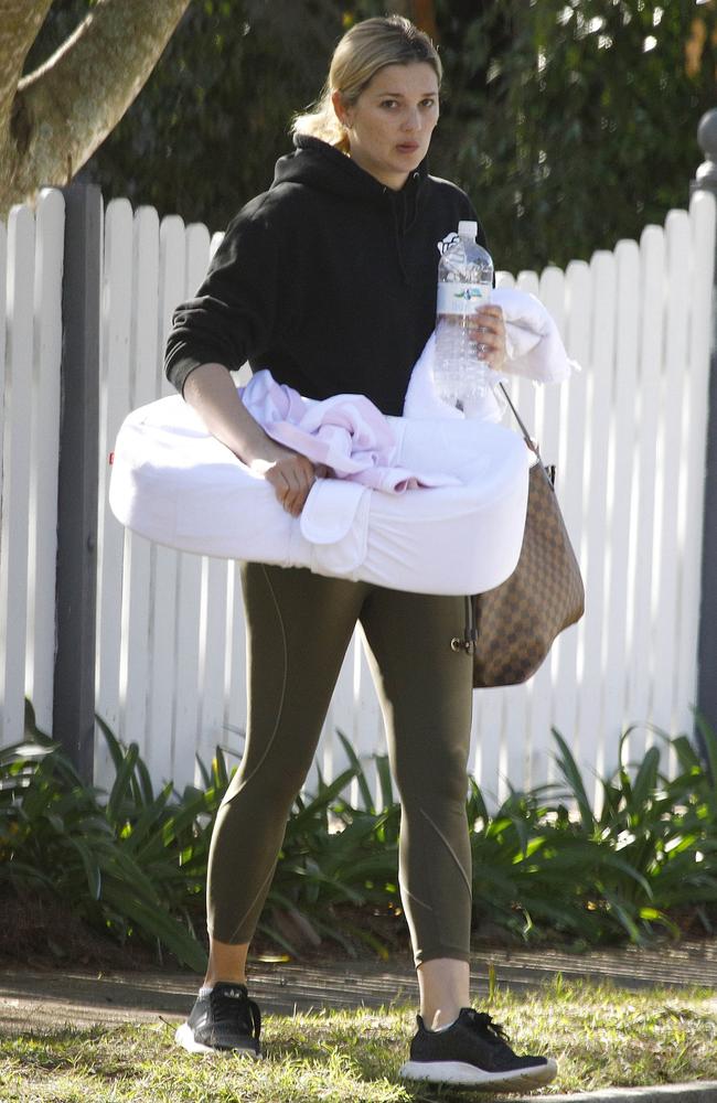 The new mum looked casual in athleisure as she packed the car. Picture: Supplied.