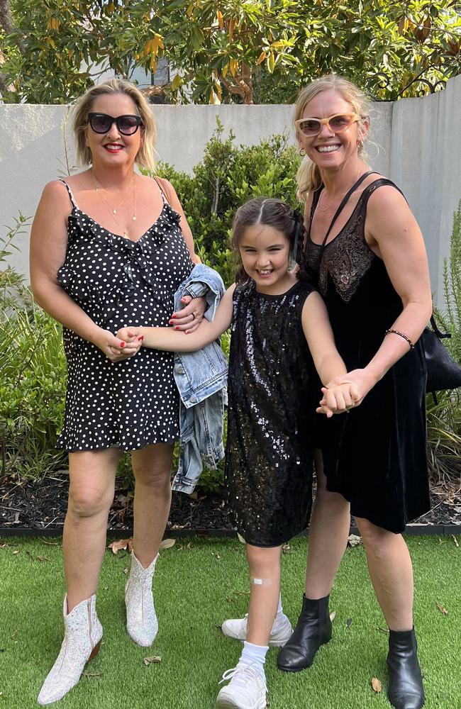 Libby Doherty, Daisy Doherty, and her carer Bianca. Picture – contributed.