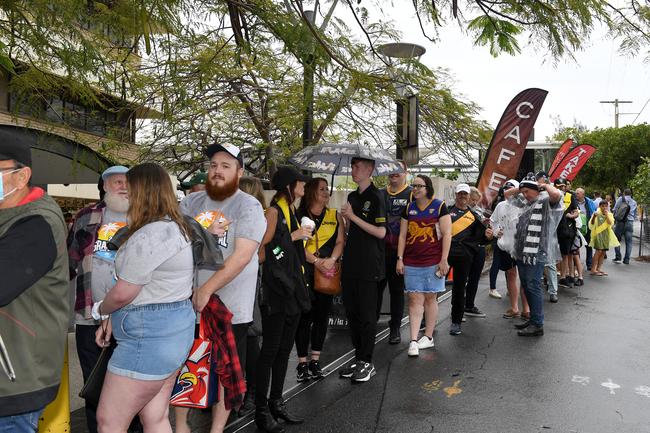 BRISBANE, AUSTRALIA - OCTOBER 24: Fans are seen lining up outside the stadium before the 2020 AFL Grand Final match between the Richmond Tigers and the Geelong Cats at The Gabba on October 24, 2020 in Brisbane, Australia. (Photo by Bradley Kanaris/AFL Photos/via Getty Images)