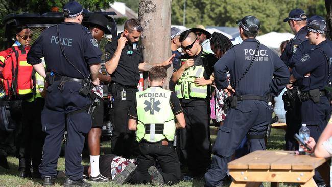 A man is treated by medics at the FOMO festival and taken away in a buggy for medical treatment. Picture: David Swift