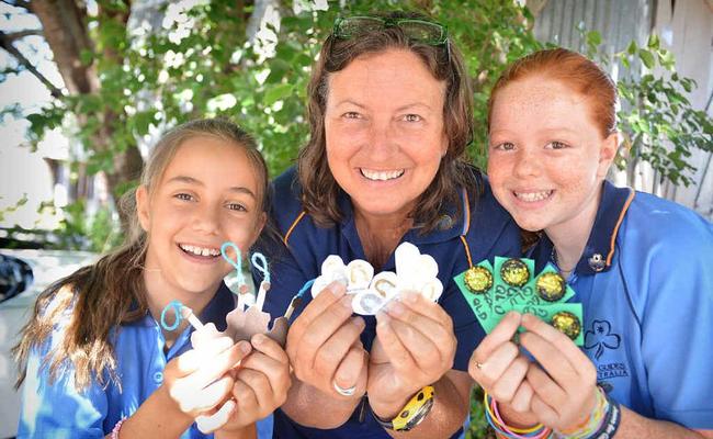 Rhiannon and Leonora Cox and Savanna Stey have their Gympie tokens ready to trade at the Australian International Guide Jamboree in Tasmania. Picture: Renee Pilcher