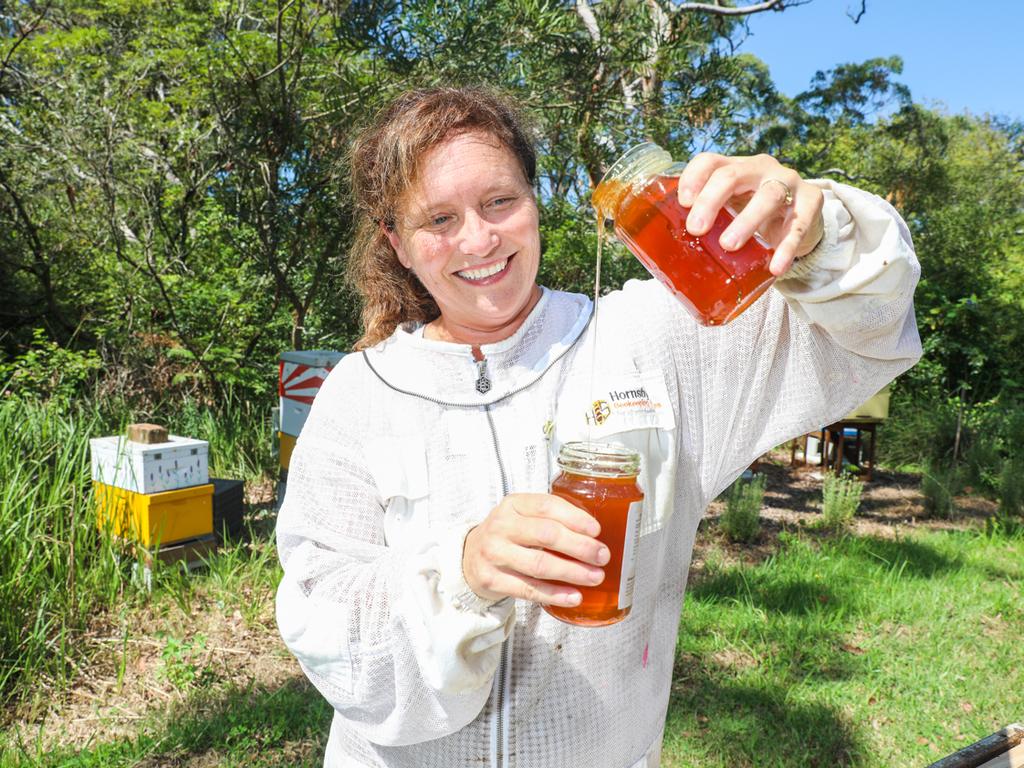 Beekeeper Michelle Blyme with her hobby bee hive. Picture: Renee Nowytarger.