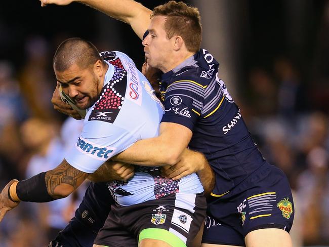 Michael Morgan jumps on Andrew Fifita’s back.