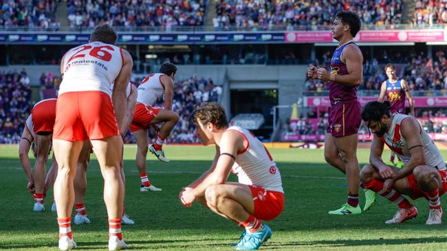 BRISBANE, AUSTRALIA - JULY 21: Sydney Swans players look dejected following the 2024 AFL Round 19 match between the Brisbane Lions and the Sydney Swans at The Gabba on July 21, 2024 in Brisbane, Australia. (Photo by Russell Freeman/AFL Photos via Getty Images)