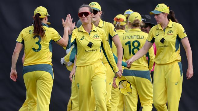 Australia's players celebrate after defeating Bangladesh. Picture: Abhishek Chinnappa/Getty Images