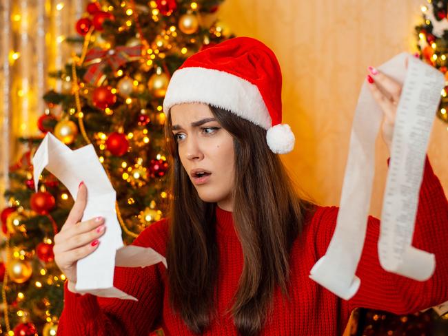 Christmas preparations, concept of much expenses on Christmas presents and decorations; spending surprise shock generic