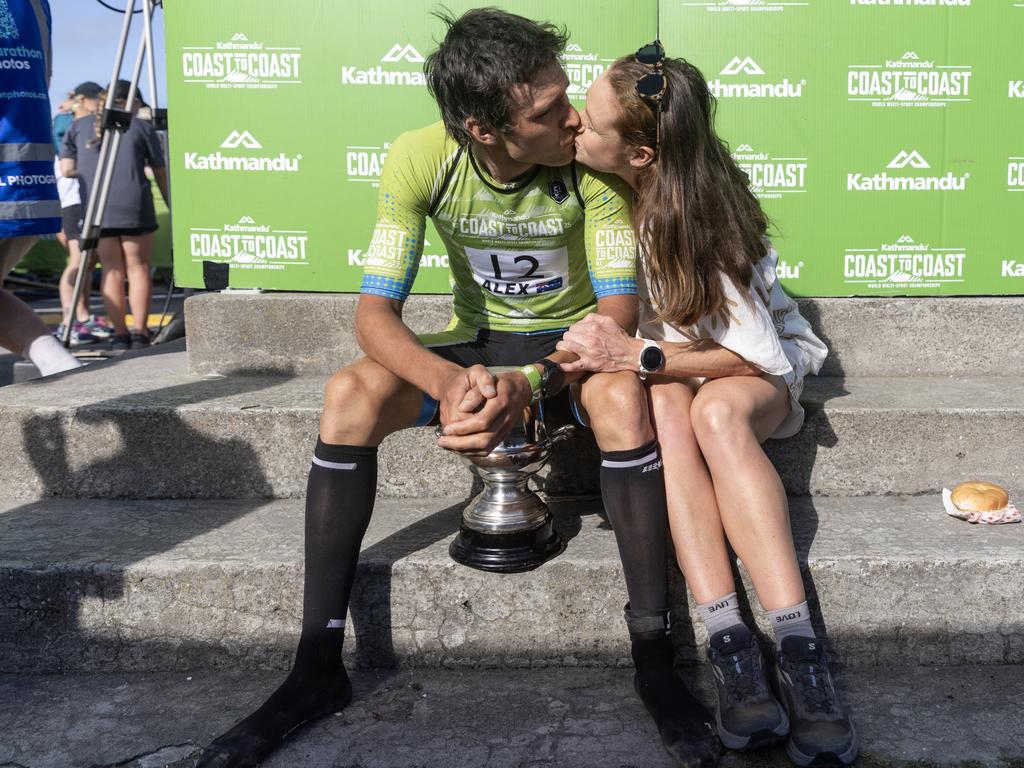 Alex Hunt is congratulated by wife Maggie Lennox after he wins the Elite mens event at the Coast to Coast finishing in Christchurch. Picture: Iain McGregor/Coast to Coast