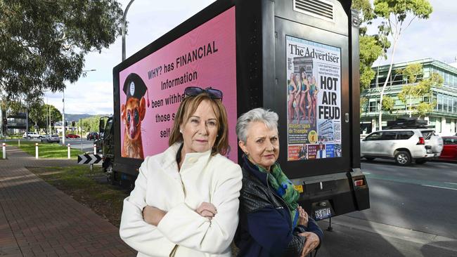 Air Apartment residents Debbie Litchfield and Sylvia Holzapfel near their protest signage at the Air Apartments. Picture: Mark Brake