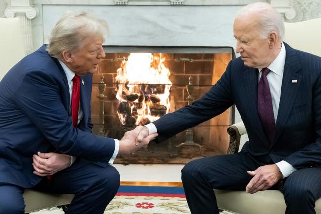 US President Joe Biden shakes hands with US President-elect Donald Trump during a meeting in the Oval Office of the White House in Washington, DC, on November 13, 2024. Trump thanked Biden for pledging a smooth transfer of power as the victorious Republican made a historic return visit to the White House on Wednesday.