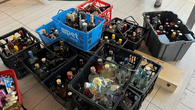 Officers from Northern District seized more than 800kg of cat food and 200 litres of various bottles of alcohol in a raid of an Elizabeth Grove home on March 28. Picture: SA Police