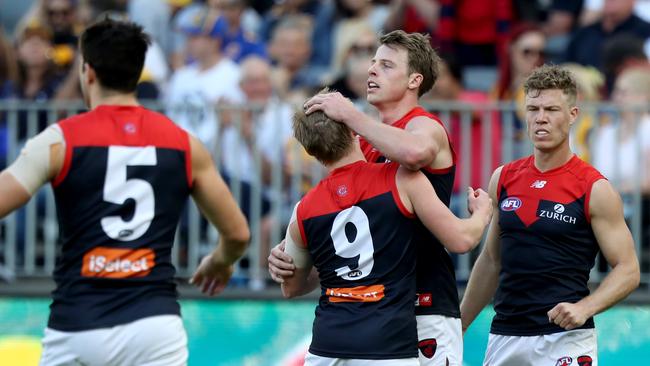 Demons get to Mitch Hannan after a big goal against West Coast. Pic: AAP