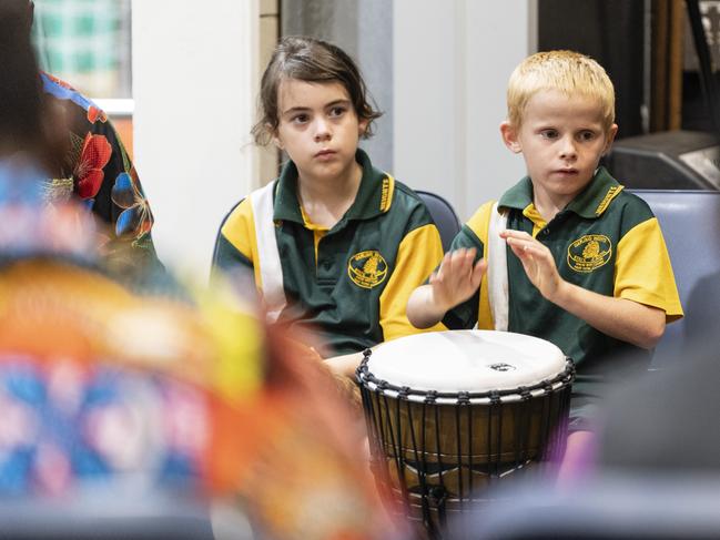 Jessica Wyatt and Jayden Stevens take part in an African drumming showcase during Harmony Day celebrations at Darling Heights State School. Picture: Kevin Farmer