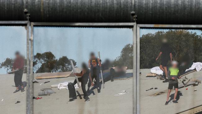 The group climbed onto the roof after assaulting inmates. Picture: Peter Lorimer