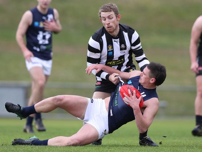 Glenorchy’s Matthew Dilger pressures Launceston’s Casey Brown. Picture: NIKKI DAVIS-JONES