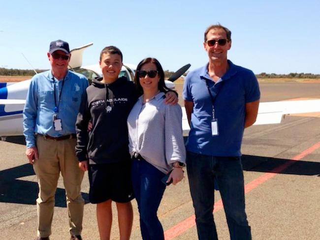 Krystle Miller with Kobi and pilots in Cobar, NSW, halfway through their journey.