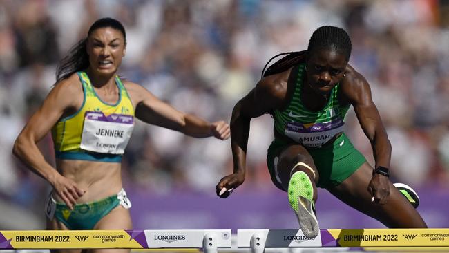 Nigeria's Tobi Amusan clears the hurdle with Michelle Jenneke just behind. Picture: Ben Stansall/AFP