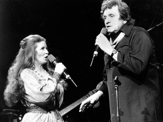 Married ... Singers June Carter &amp; husband Johnny Cash sing together at Radio City Music Hall in New York City in 1985.