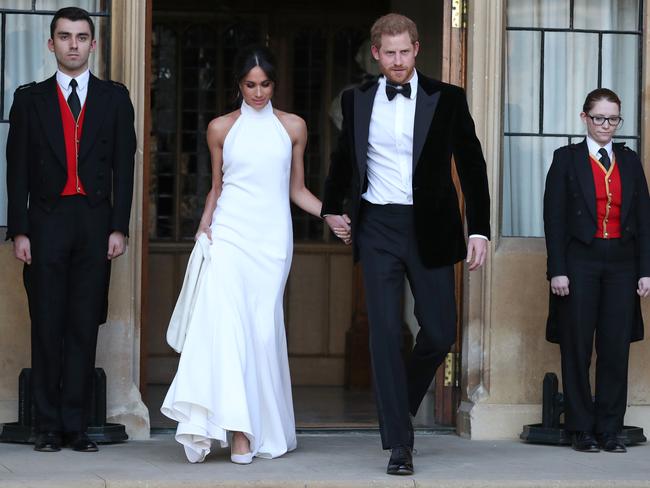 The Duke and Duchess of Sussex head to the evening reception after the Royal Wedding. Meghan wears a dress by Stella McCartney. Picture: MEGA