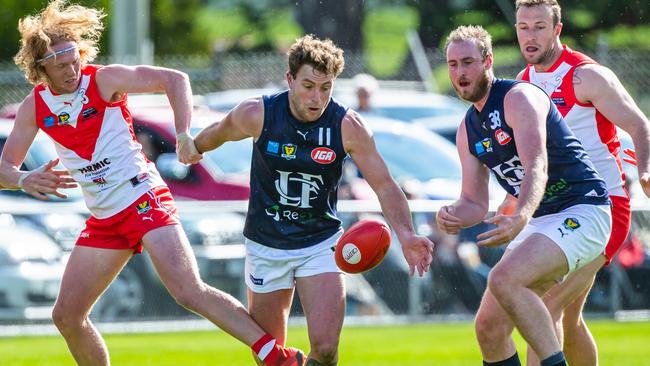 Launceston's Jobi Harper battles for the ball against Clarence’s Ethan Jackson and teammate Joe Groenewegen in the round 12 TSL clash at Richmond Oval. Picture: Solstice Digital