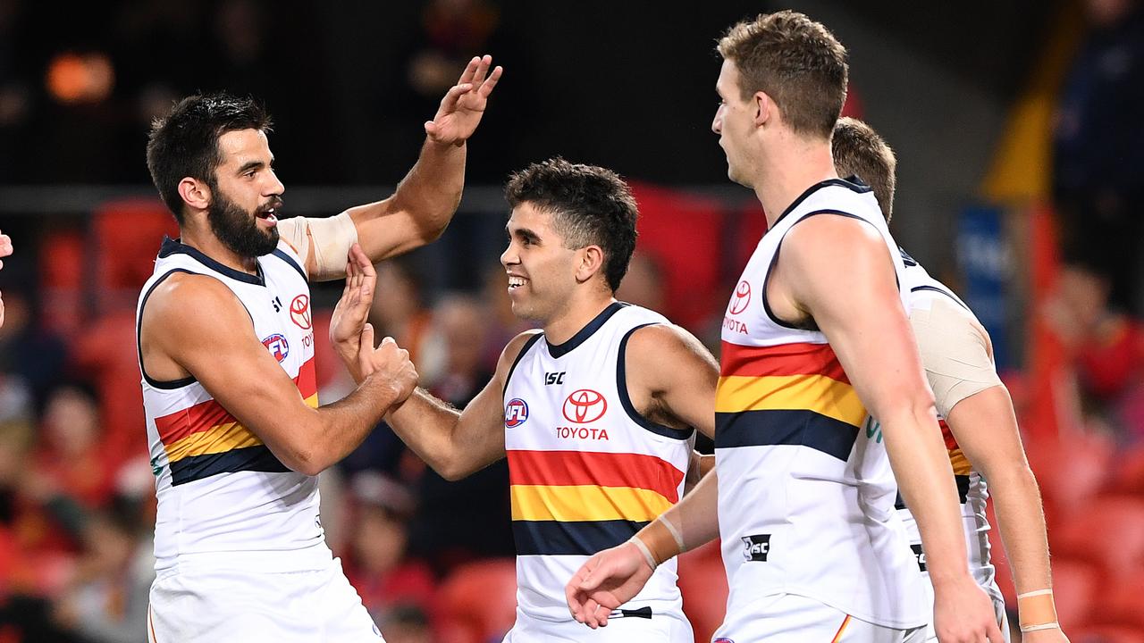 Tyson Stengle of the Crows is congratulated by Wayne Milera after he kicked his first goal for Adelaide. Picture: AAP Image/Dave Hunt