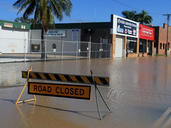 Water begins to rise around businesses closer to the city centre. Picture: Tim Marsden