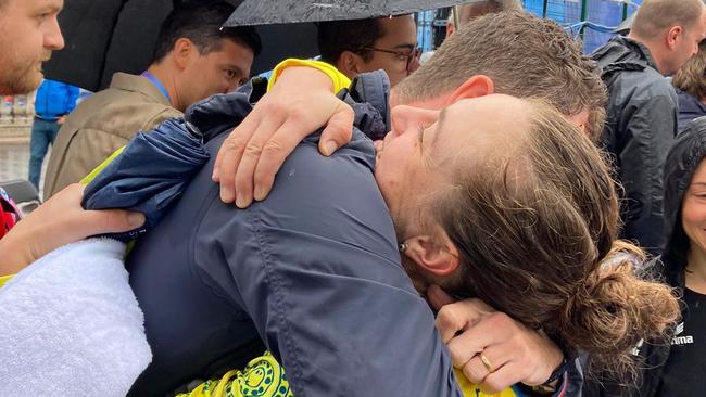 Australian cyclist Grace Brown embraces her husband Elliott Smith after winning the individual time trial at the 2024 Paris Olympics.