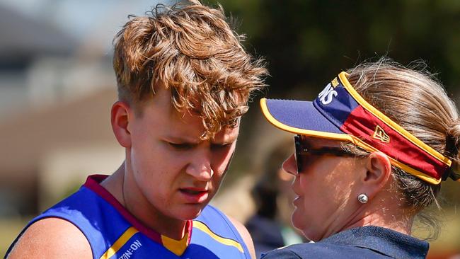 MELBOURNE, AUSTRALIA - NOVEMBER 03: Dakota Davidson of the Lions is consoled by a staff member during the 2024 AFLW Round 10 match between Euro-Yroke (St Kilda Saints) and the Brisbane Lions at RSEA Park on November 03, 2024 in Melbourne, Australia. (Photo by Dylan Burns/AFL Photos via Getty Images)