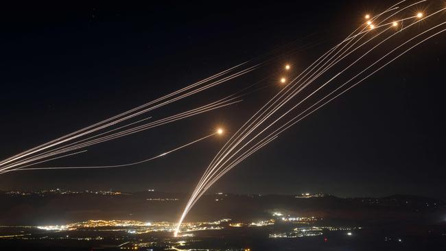 Rockets fired from southern Lebanon are intercepted by Israel's Iron Dome air defence system over the Upper Galilee region in northern Israel. Picture: AFP