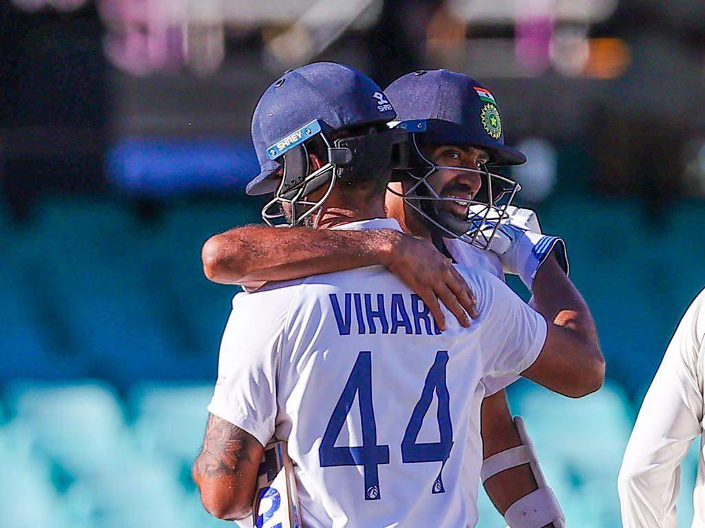 India's Ravichandran Ashwin embraces his teammate Hanuma Vihari.