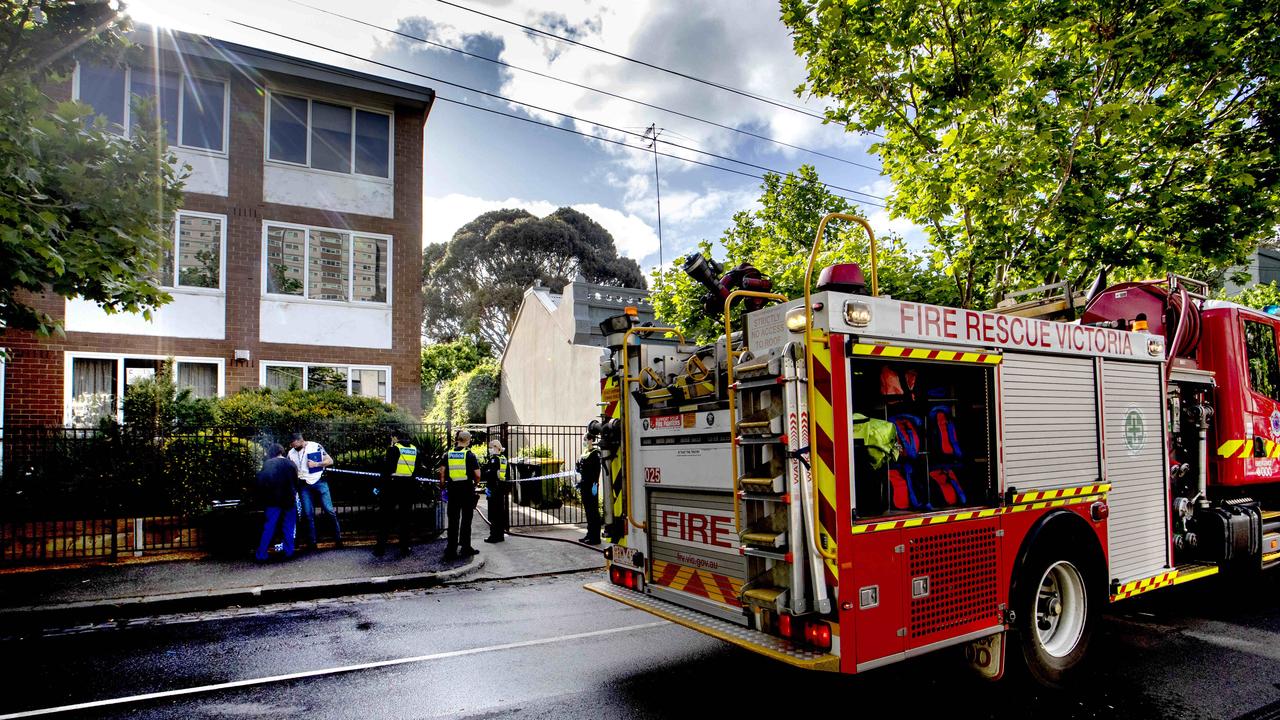 Firefighters rescue man trapped under silo in Kensington | Herald Sun