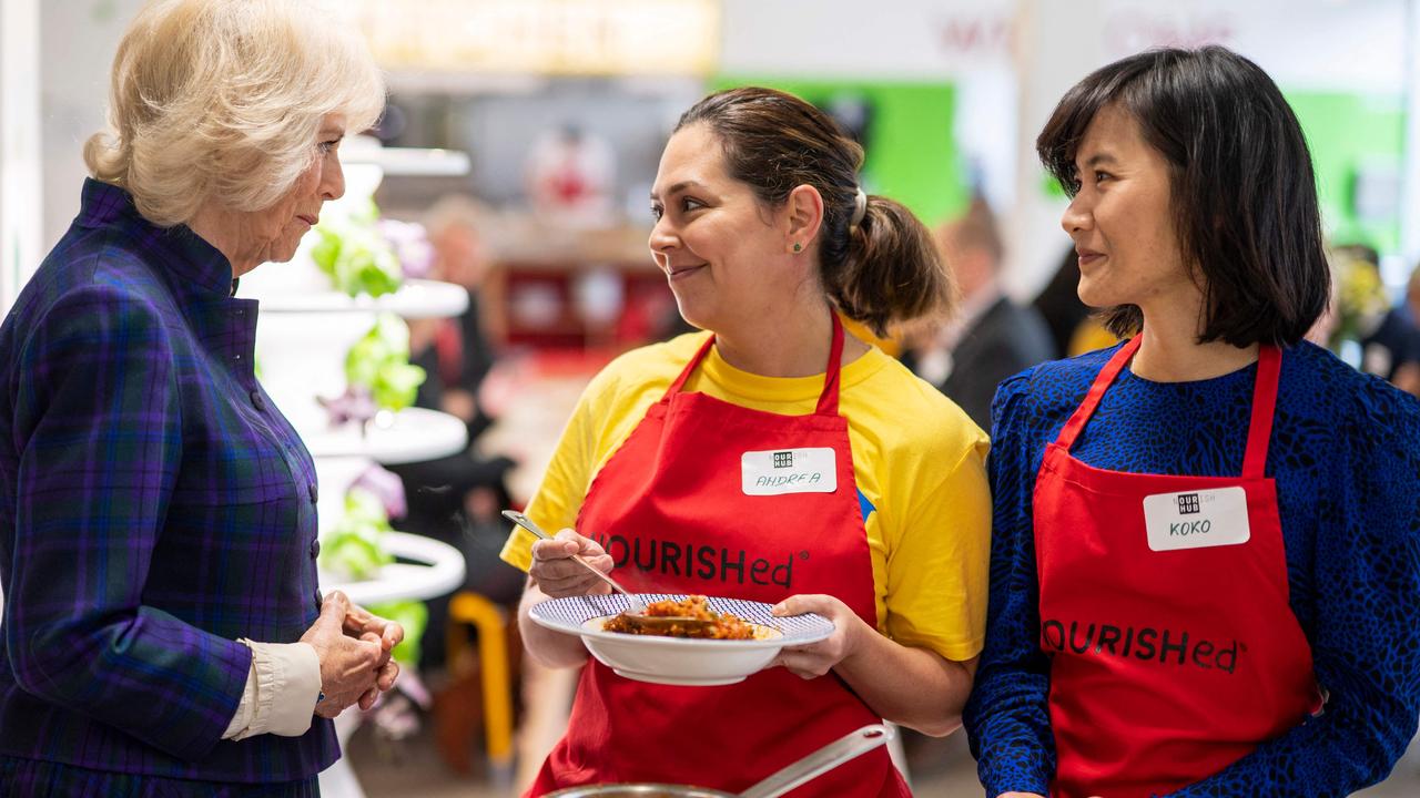 Camilla speaks to members of staff as she attends the opening of the charity and community Kitchen "Nourish Hun" on February 10. Picture: Geoff Pugh / AFP)