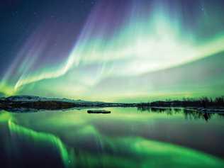 Tromso is one of many places to watch the Northern Lights blaze, as is Lake Thingvellir National Park in Iceland. Picture: sumos