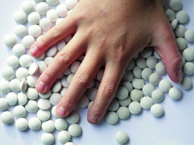 TWAM-20160910  EMBARGO FOR TWAM 10 Sep 2016Pills and child's hand Pic : iStock