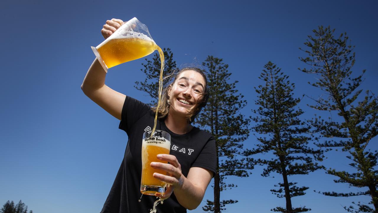 Bartender Rosie King pours a Moffat Beach Brewing Co. Moff’s Summer Ale. Picture: Lachie Millard