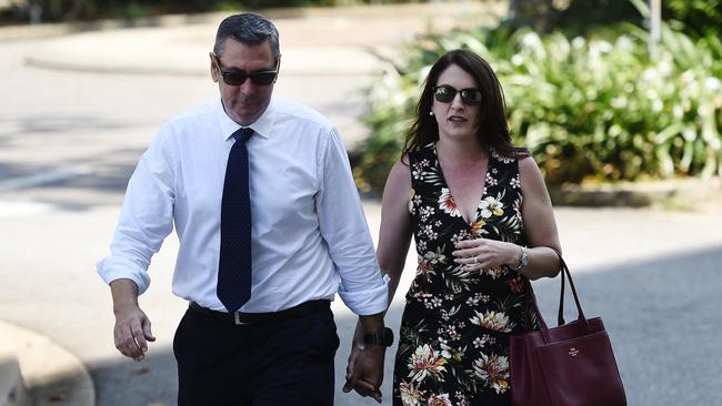 Former Elders real estate agent Chris Deutrom enters the NT Supreme Court with his wife, Helen