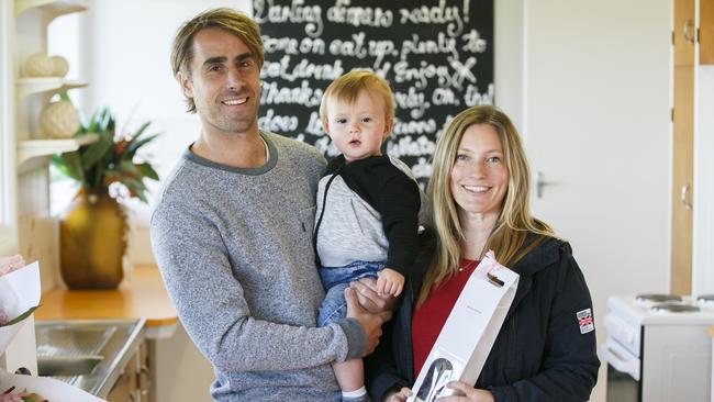 Bradley and Elke with 18-month old Riley at their new house in Collaroy Plateau. AAP IMAGE/ Tim Pascoe