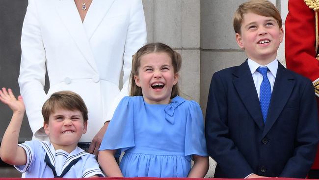 Prince Louis, Princess Charlotte and Prince George watch a special fly-past from the Buckingham Palace balcony. Picture: AFP.