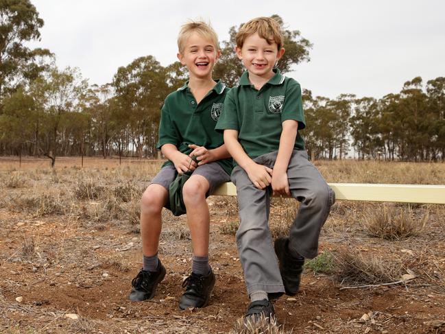 Tullamore Central School students Levi McMahon, 6, and Jimmy Aveyard, 6, pictured on the dry school grounds. Picture: Jonathan Ng