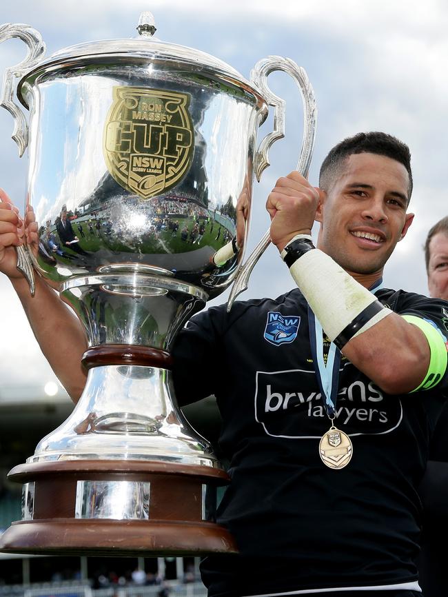 Mounties captain John Kennedy holds up the Ron Massey cup. Picture: Justin Sanson.