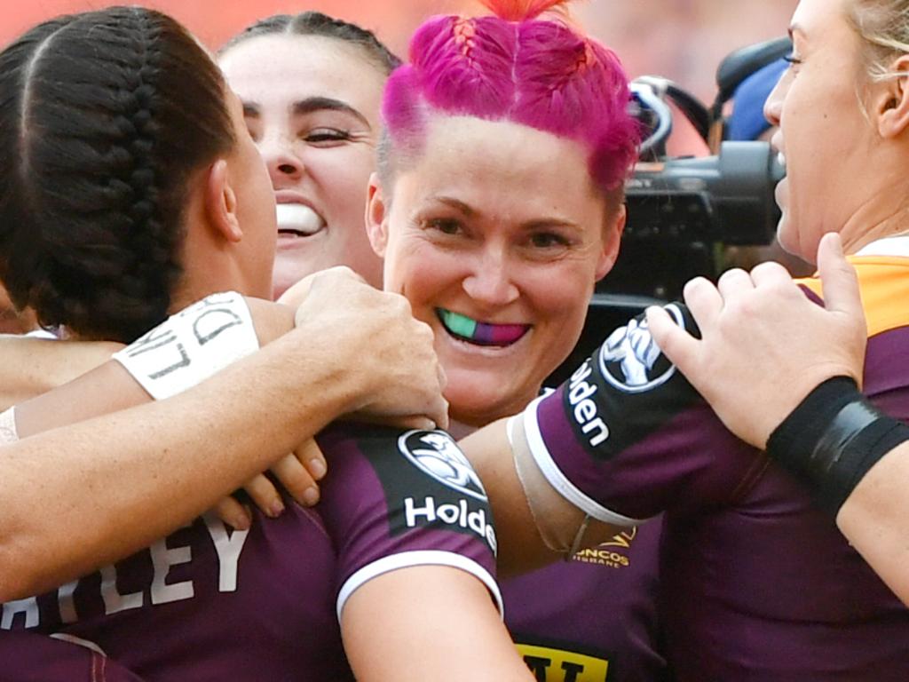 Chelsea Baker (centre) of the Broncos celebrates scoring a try with team mates during the NRL Women's Premiership match between the Brisbane Broncos and the St George-Illawarra Dragons at Suncorp Stadium in Brisbane, Sunday, September 9, 2018. (AAP Image/Darren England) NO ARCHIVING, EDITORIAL USE ONLY