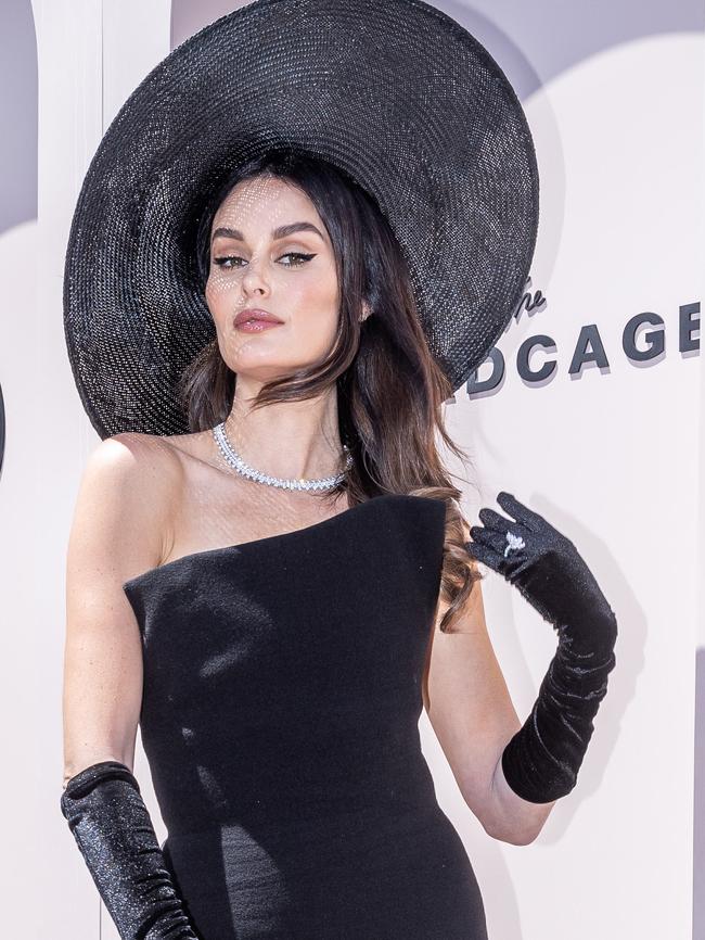 Nicole Trunfio in a Max Mara dress and jewellery by Anton Jewellery and Cerrone around her neck and on her gloved finger, worth more than $100,000.