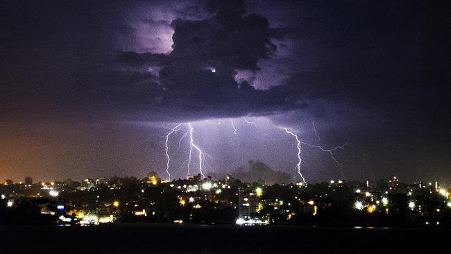 Lightning flashes appear to strike Mosman and the northern beaches.Photos: Chris McKeen