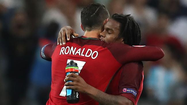 Portugal's midfielder Renato Sanches (R) celebrates with Portugal's forward Cristiano Ronaldo.