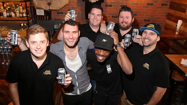 Josh Fordham, Charlie Ford, Tendai, Andrew Schroder, Mike Rogers and Corey Scown with the new Beer Buddy Brew. Pictures: Peter Kelly