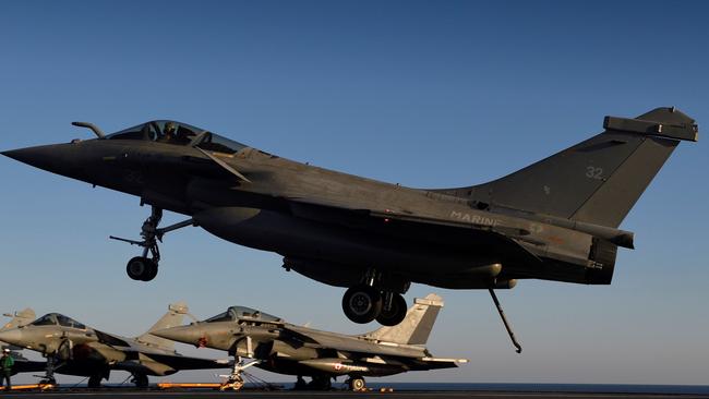 Three Rafale Marine jets from French aircraft carrier Charles de Gaulle will join RAAF Base Darwin ahead of the event. / AFP PHOTO / Eric FEFERBERG