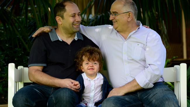 Ivica Cukovic with his daughter Julija and Jim Filipovic, who helped bring her over to Adelaide from Serbia. Picture: Tricia Watkinson